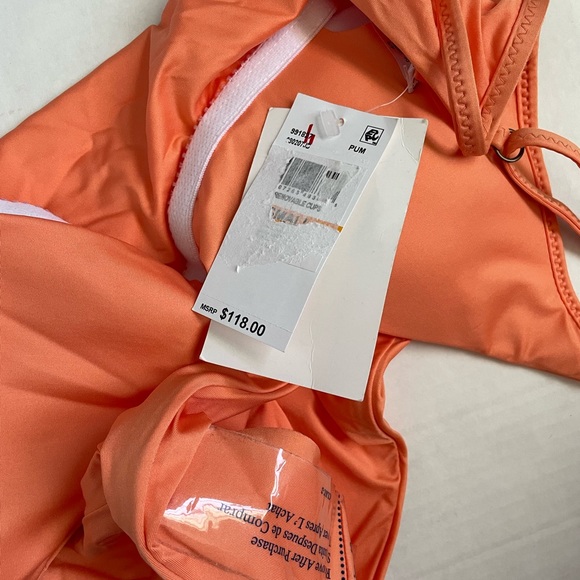 Becca
Solid V-Neck One-
Piece Swimsuit - Picture 2 of 4